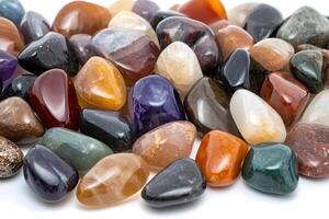 Colorful tumbled gemstones creating a vibrant and diverse arrangement photo