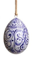 Decorated easter egg hanging on a string with blue pattern on white background photo