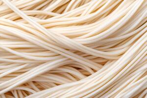 Close-up of Uncooked Noodles creating an Appealing Culinary Background photo
