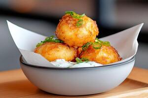Potato croquettes served with dipping sauce are waiting to be eaten photo