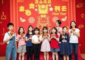A group of children holding chinese new year decorations photo