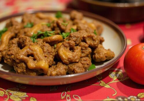 A plate of meat and vegetables on a table photo
