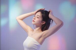 A woman in a white dress posing in front of a colorful background photo