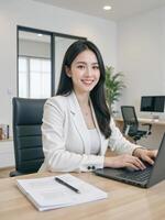 professional businesswoman smiling while focusing on her laptop, sitting at a sleek desk in a modern office with clean lines and vibrant accents photo