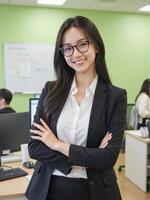 Asian business woman in office with her arms crossed photo