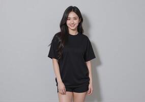 A woman in black t - shirt and shorts posing for the camera photo