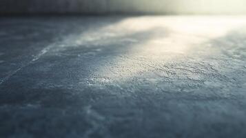 A grey concrete floor with a few specks of water on it photo
