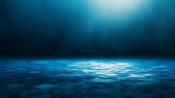 Mysterious blue illuminated surface in the dark. photo