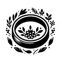 A stark black and white circular emblem featuring a detailed floral within an oval frame, surrounded by a delicate border of leaves and dots, evoking elegance. vector