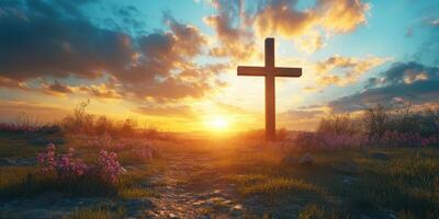 Serene sunset over a cross in a tranquil landscape with blooming flowers and a winding path photo