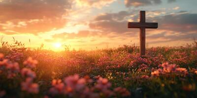 Sunset over a tranquil meadow with a wooden cross amidst vibrant flowers photo