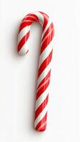Candy cane with red and white stripes on a clean background highlighting the festive spirit of the holiday season photo