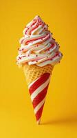 Sweet dessert treat with swirled frosting and colorful sprinkles on a bright yellow background photo