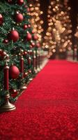 Festive red carpet pathway lined with Christmas trees and twinkling lights during holiday season celebration at night photo