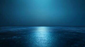 A calm body of water with a blue sky in the background photo