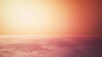 A large empty space with a bright orange sky in the background photo