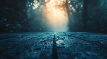A blurry image of a forest floor with a line of trees in the background photo