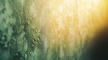 A wall with a greenish color and a blurry background photo