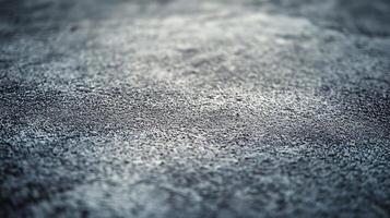 A blurry image of a grey surface with a few white specks photo