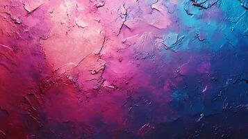 Colorful textured surface in vibrant pinks purples and blues creating a visually striking abstract pattern with rough edges and subtle cracks photo