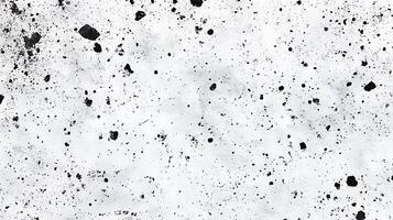 Abstract texture featuring black splatter and spots scattered across a bright clean and minimalistic white background creating a dynamic look photo
