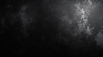 A textured dark surface with subtle gradients of black and gray reminiscent of a weathered material under dim lighting photo