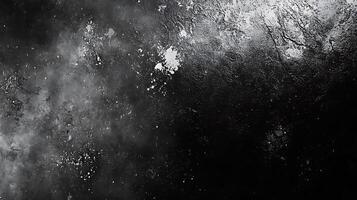 Abstract black background with mottled grey and white textures resembling a galactic sky or a weathered surface Minimalist and dramatic photo