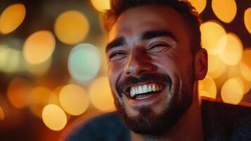 Joyful man with a bright smile against a backdrop of glittering lights encapsulating happiness and warmth photo