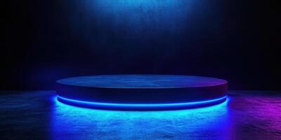 Circular stage illuminated by vibrant blue and purple lights in dark environment at night photo