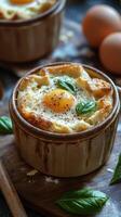 Freshly baked egg dishes with herbs served in rustic ceramic bowls on a wooden board photo