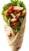 Tasty chicken wrap filled with fresh vegetables and garnished with lettuce on a white background photo