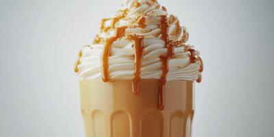 Creamy caramel dessert served in a glass with whipped topping and drizzle at a cozy cafe photo
