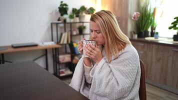 Warm moments of relaxation with a cozy drink in a serene home setting during a quiet afternoon video