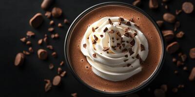 Creamy hot chocolate topped with whipped cream and chocolate shavings in a cozy setting photo