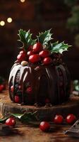 Rich chocolate cake topped with cherries and holly in a festive setting for holiday celebrations photo