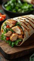 Delicious grilled chicken wrap with fresh vegetables served on a wooden table photo