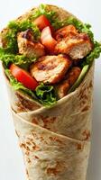 Grilled chicken wrap with fresh vegetables in a soft tortilla for a healthy meal option photo