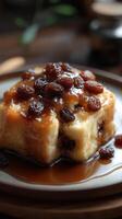 Delicious dessert featuring sweet custard topped with raisins and syrup served in a cozy setting photo