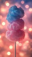 Colorful cotton candy stands tall against a dreamy bokeh background at a festive event photo