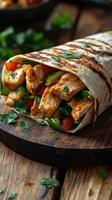 Grilled chicken wrap filled with fresh vegetables served on a wooden board in a cozy setting photo