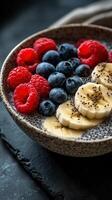 Delicious bowl of chia seed pudding topped with fresh berries served in a rustic setting photo