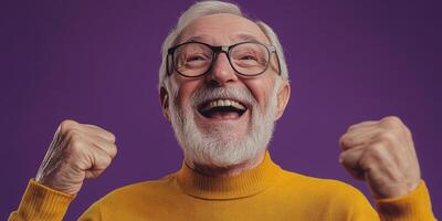 Happy elderly man celebrating with joy in a vibrant studio background during a cheerful moment photo