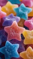 Colorful star-shaped gummies arranged together in a vibrant display with sparkling sugar coating photo