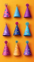 Colorful party hats arranged creatively against a bright orange background for festive celebrations and gatherings photo
