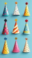 Colorful party hats arranged on a blue background for a festive celebration or event photo