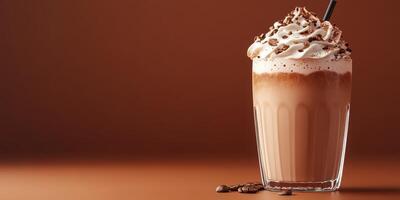 Delicious chocolate milkshake topped with whipped cream served in a glass against a warm backdrop photo