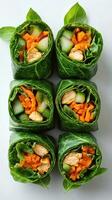 Fresh vegetable and chicken wraps displayed on a white surface during a healthy meal preparation in a bright kitchen photo