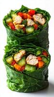 Fresh vegetable and chicken collard green wraps made with colorful ingredients for a healthy snack or meal preparation photo