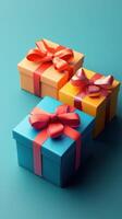 Colorful gift boxes arranged on a teal background, showcasing vibrant ribbons and cheerful packaging designs for celebrations photo