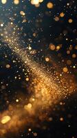 Sparkling golden particles create a mesmerizing cosmic effect in a dark background during nighttime photo